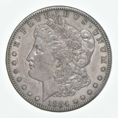 Dólar de plata Morgan en estado bastante bueno 1884-s (1 moneda) Foto 1 de 4