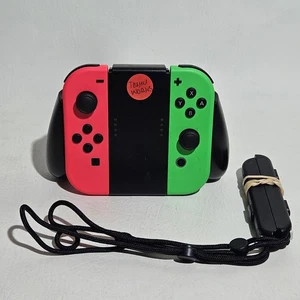 Coppia Joy Controller Nintendo Switch - Rosa Neon/Verde Neon con Impugnatura e Guide - Foto 1 di 7