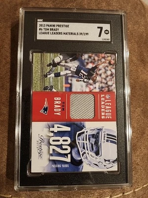 2013 Panini Prestige Tom Brady League Leaders Materials Jersey #039/199 SGC 7 NM - Image 1 of 3