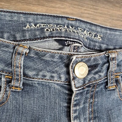 Pantalones de mezclilla elásticos de tiro bajo ajustados azules para mujer American Eagle 4S Foto 1 de 4