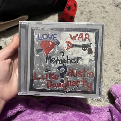 Luke Austin Daugherty - Love, War & Metaphor (2007 Pilgrim's Journey) - Used CD - Imagem 1 de 4
