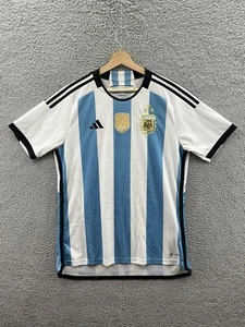 Adidas Herren Argentinien 22 Sieger Heim Trikot Größe L weiß hellblau - Bild 1 von 3