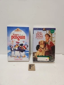 LotOf2 VHS The Pebble And The Penguin, Far From Home The Adventures Of YellowDog - Picture 1 of 14