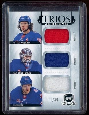 2021-22 The Cup Cup Trios Jerseys Artemi Panarin/Adam Fox/Igor Shesterkin 11/35 - Image 1 of 2