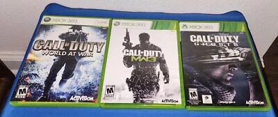 3 Call of Duty Xbox 360 Spiele Ghosts, MW3, World at War & Anleitungen - Bild 1 von 2