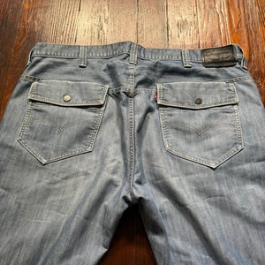 Levis 569 Premium Jeans Herren 42x32 blau locker gerade Y2K Pattentaschen - Bild 1 von 12