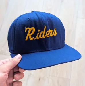 Berretto sportivo snapback Delong vintage anni 80 blu 'Riders' ricamato / made in USA - Foto 1 di 6