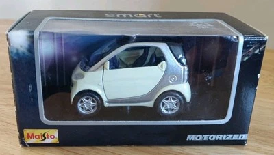 Maisto Smart Coupe 1/33 Scale Diecast 21103  Cream & silver. New in Box. - Image 1 of 4