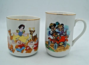 LOTTO 2 TAZZE VINTAGE DISNEY MICKEY MINNIE BIANCO NEVE 7 NANI TAZZA CAFFÈ - Foto 1 di 7
