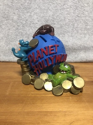 Moneda globo planeta Hollywood alcancía cocodrilo y dinosaurio plástico años 90’s Foto 1 de 4