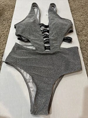 Traje de baño Bebe de una pieza plateado metálico brillante recortes laterales talla M ¡GUAU! Foto 1 de 4