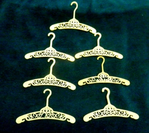 Lot of 7 Vintage Barbie Doll Filigree Yellow Clothes Hangers - Picture 1 of 3