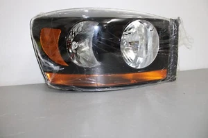 2006 DODGE RAM 1500 RIGHT SIDE HEADLIGHT BLACK BEZEL - Picture 1 of 7