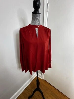 Blusa para mujer naranja quemado/rojo manga larga cuello mandarín. Recorte en V. Puños Foto 1 de 4