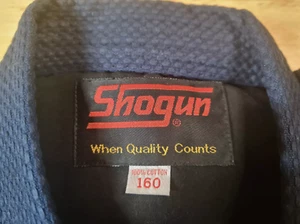 Shogun MARTIAL ARTS Jujitsu Kimono Keikogi Top %100 Baumwolle Unisex Gr.160 Blau - Bild 1 von 7