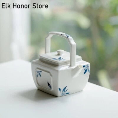 Tetera japonesa de 150 ml pura pintada a mano con vigas de orquídea mariposa ventana abierta Foto 1 de 4