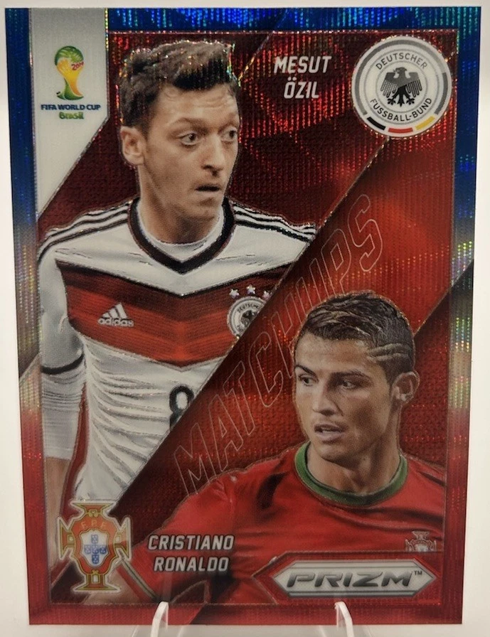 2014 Cristiano Ronaldo / M. Ozil Panini Prizm World Cup Matchups - Blue/Red Wave - Image 1 of 2