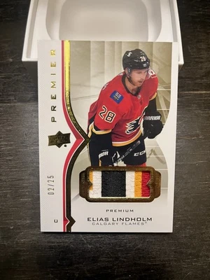 2020-21 UD PREMIER PATCH BASE PARALLEL 2/25 ELIAS LINDHOLM #18 CALGARY FLAMES - Image 1 of 2