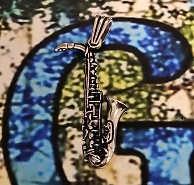 Colgante musical saxofón jazz/plata 925 oxidada 6,45 gramos  Foto 1 de 3