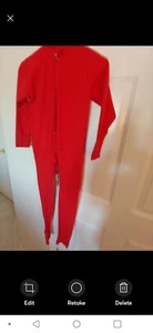 Bright red jumpsuit with button-up front. Long sleeves and high collar. - Picture 1 of 3