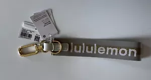 LULULEMON Never Lost Keychain Wordmark - Vapor / Gold - NEW with Tags - Picture 1 of 4