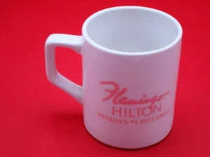 TAZA TAZA CAFÉ FLAMINGO HILTON PLAYLAND NEVADA BLANCA Y ROSA 10 ONZAS - Imagen 1 de 2
