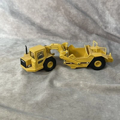 NORSCOT 1/64 Scale Cat Wheel Tractor 611 Scraper Diecast Car Model Toy 55308 - Image 1 of 4