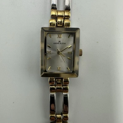 Anne Klein 手表女式银色金色双色 15 毫米矩形表盘全新电池 — 第 1/4 张图片