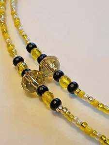 GELBE UND SCHWARZE BRILLENKORDEL MIT GELBEN TSCHECHISCHEN KRISTALLAKZENTEN - Bild 1 von 4