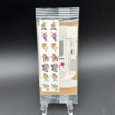 Nintendo Game Boy Kellogg’s 1995 Dispensador de Pegatinas y Pegatinas Nuevo en Paquete Foto 1 de 4