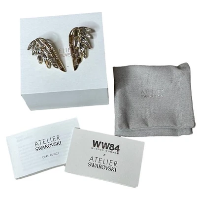 Pendientes Swarovski Atelier Wonder Woman blancos, chapados en oro Foto 1 de 4