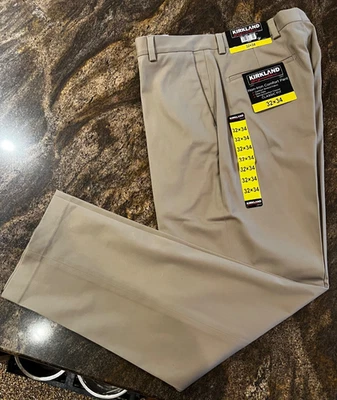 Pantalones caqui Kirkland Signature para hombre nuevos con etiquetas W32 L34 frente plano 2 % spandex Foto 1 de 4
