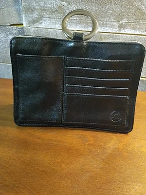 Bolso organizador de mano Pouchee The Ultimate negro cierre magnético asas de anillo de metal Foto 1 de 4