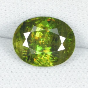 3.66 ct DAZZLING YELLOW GREEN MULTI FLASHING NATURAL SPHENE  OVAL  See Vdo BY - Picture 1 of 2
