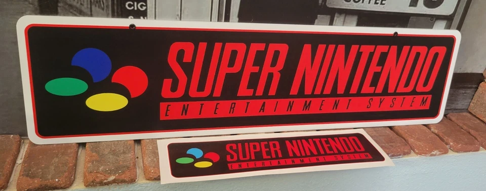 Letrero de aluminio con logotipo de Super Nintendo de 6" x 24" con calcomanía gratis. Foto 1 de 1
