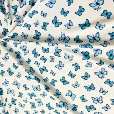 Blue Butterflies White background Print Nylon Spandex Fabric 4 Way Stretch - Image 1 of 4