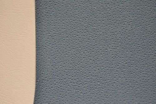 Gray 1968-69 Ford Torino Fastback with medium blue headliner, mesh fabric, and tan leather side panels.