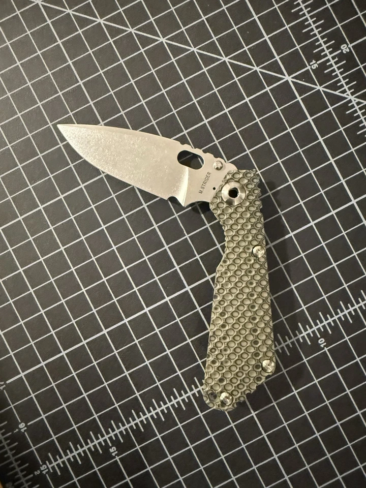 Cuchillos Strider SnG DGG - Hoja Sucia Verde Oliva G10 y Antigua Ti S30V Foto 1 de 4