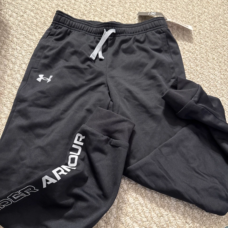 Pantalones cónicos Under Armour Pitch gris/negro UA Brawler 2.0 para niños jóvenes medianos Foto 1 de 4