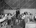 45np-1718 1940 Tyrone Power in costume toasts w cast and crew on set film The Ma