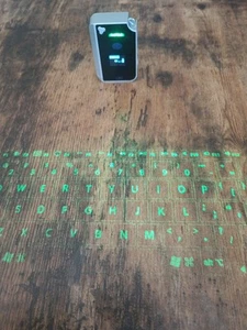 Brookstone CTX (Model: VK200 Keyfob) BT Virtual Bluetooth Keyboard - Picture 1 of 3