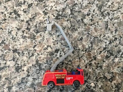 Vintage 1981 Matchbox red snorkel firetruck with extended bucket w/fireman - Image 1 of 4