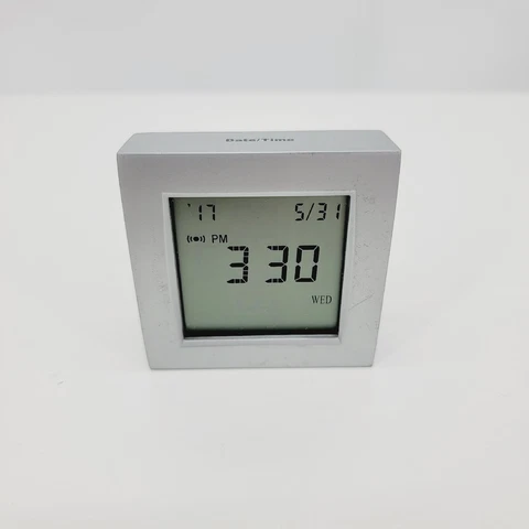 BROOKSTONE - QUARTZ TRAVEL CLOCK, WORLD TIME, TEMPERATURE, TIMER. IN METAL BODY Cover