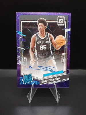 2023-24 Panini Donruss Optic Sidy Cissoko Rated Rookie Purple Velocity Auto /3 - Image 1 of 2