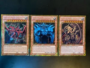 Yugioh! 1. Edición - Juego de cartas de dioses PGLD Slifer Obelisk Ra - Gold Secret Rare - Imagen 1 de 10