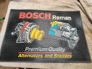 VINTAGE BOSCH REMAN ALTERNATORI E STARTER BANCO CONCESSIONARIA TAPPETINO GOMMA RARO - Foto 1 di 10