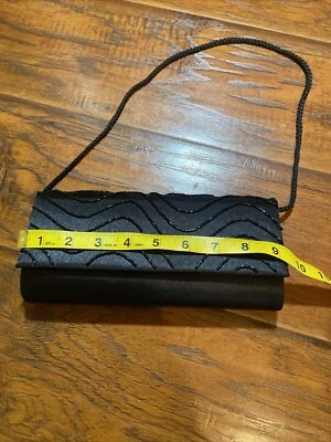 Cartera clutch pequeña negra para dama Foto 1 de 4