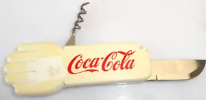COCA-COLA© - DECAPSULEUR CANIF TIRE BOUCHON MAIN 9,5 cm FERME N° 1657 - Imagen 1 de 2