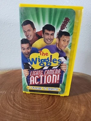 The Wiggles Lights Camera Action! VHS Yellow Hard Cover - Image 1 of 4
