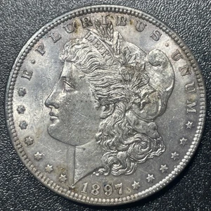 Dólar de plata Morgan 1897-P $1 tonificación anverso sin circular - Imagen 1 de 2